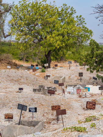 Joal-Fadiouth, Afrika - Jan, 2019: Metal tablets on the tomb of mixed Muslim-Christian cemetery. The city and municipality of Joal-Fadiouth in the ThiÃ¨s region at the end of the Petite CÃ´te of Senegalの写真素材