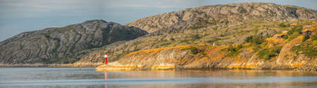 Panoramic view foe small lighthouse and the hill around the fjord in Bodo. Nordland. Europe. Lofoten...