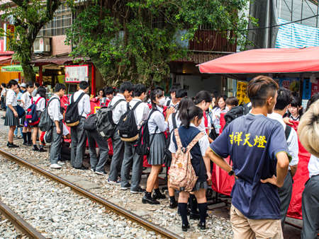 Shifen, Taiwan - October 05, 2016: The Taiwanese youths writing down their dreams on big colorful...