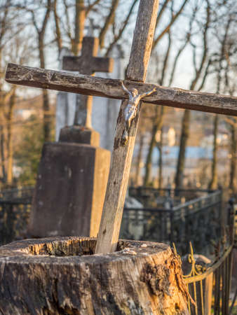 UÅ¾upis, Vilnius, Lithuania - April 08, 2018: Bronze Angels and cross on a tomb on local cemetery in Vilnius, Europeのeditorial素材