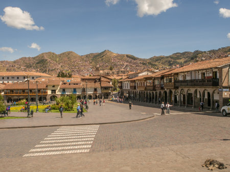 Cusco, Peru - May 22, 2016: View of the main square in Cusco and hills with small villages in the...