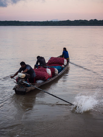 Santa Rosa, Brazil - September 22, 2018: Different types of potatoes in a big sack on the small...