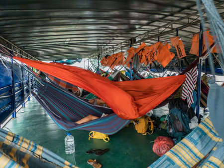 Amazon River, Peru - Sep 19, 2019: Portrait of a small girl on the hammock - an inhabitant of the Peru. Amazonia. South Americaのeditorial素材
