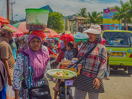 Ambon., Indonesia - Feb, 2018: Crowd of the local people selling and buying different goods on the market, Island of Ambon, Maluku, Indonesia. Asiaのeditorial素材