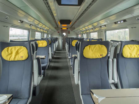 Warsaw, Poland - October 20, 2017: Interior of empty railway carriage. Modern polish economy class fast train interior. No people inside of high speed train compartment. Eastern Europeのeditorial素材