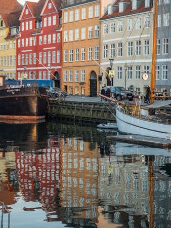 Nyhavn (New Harbor), Copenhagen, Denmark - 14 JMay 2019: Sunset view of Nyhavn pier with color buildings, ships, yachts and other boats in the Old Town of Copenhagen, Denmark, Europeのeditorial素材