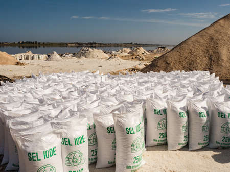 Lac Rose, Senegal, Africa (Pink Lake) - Feb 2019: Sacks of salt extracted from Retba Lake with red water. This is a UNESCO World Heritage Site. It is located north of the Cap Vert peninsula in Senegalのeditorial素材