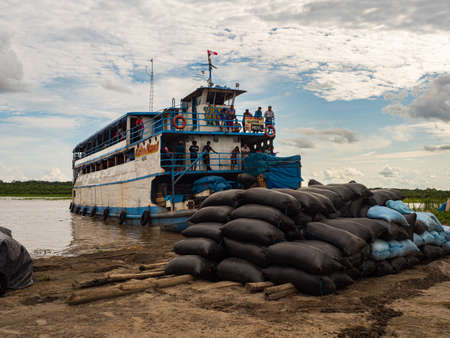 Amazon River, Peru - December 04, 2018: View of slow boat 'Victor Manuel' in the small port on the Amazon Riverのeditorial素材