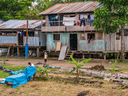 Amazon River Basin, Peru - December, 2018: Wooden house on stilts in a small village in the Amazon jungle in South America.のeditorial素材