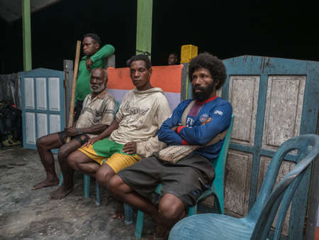 Kensi, Arguni, Indonesia - February 06, 2018: Crowd of local people from the Mairasi tribeのeditorial素材