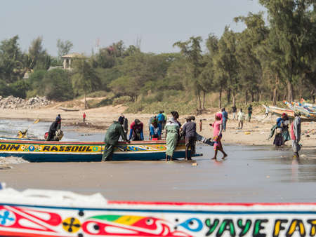 Nianing, Senegal - January 24, 2019: Colorful wooden fishing boats in Senegal, Africaのeditorial素材