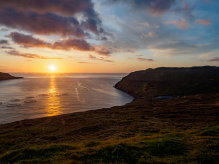 Magic sunrise with beautiful clouds over ocean on Faroe Island. Denmark. Northern Europeの写真素材