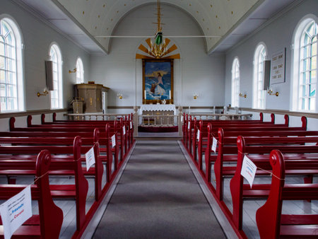GjÃ³gv, Faroe Island- Sep 2020: Empty benches in the church during the coronavirus era (COVID-19). Gjogv. Denmarkのeditorial素材