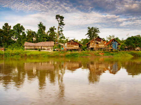 West Papua, Indonesia - January, 2015: Wooden houses on the stilt in the jungle on the bank of the Brazza River. Asiaのeditorial素材