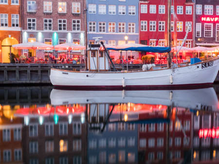 Nyhavn (New Harbor), Copenhagen, Denmark - 14 JMay 2019: View of Nyhavn pier with color buildings, ships, yachts and other boats in the Old Town of Copenhagen, Denmark, Europe. Night time,のeditorial素材