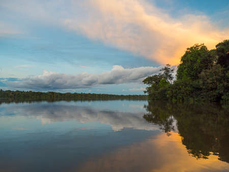 Sunset view of Coati Lagoon near the Javari River, the tributary of the Amazon River, Amazonia. Selva on the border of Brazil and Peru. South America.の写真素材