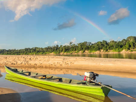 Wooden boats on the sandy beach at the Javari River, the tributary of the Amazon River, during the low water season. Amazon. Selva on the border of Brazil and Peru. South America. Dos Fronteras.の写真素材