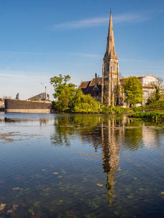Copenhagen, Denmark - May 2019: St Alban's Church seen from Kastellet Bridge above the moat near the Kastellet fortress. It is an Anglican church in Copenhagen. Europeのeditorial素材