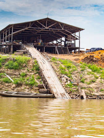 Benjamin Constant, Brazil - May 2016: Sawmill on the river bank in the Amazon jungle. Amazon. Latin Americaのeditorial素材