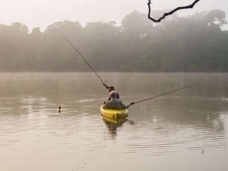 Kayaking during sunrise at beatiful landscape over the Lagoon San Antonio, Peru, Amazonのeditorial素材
