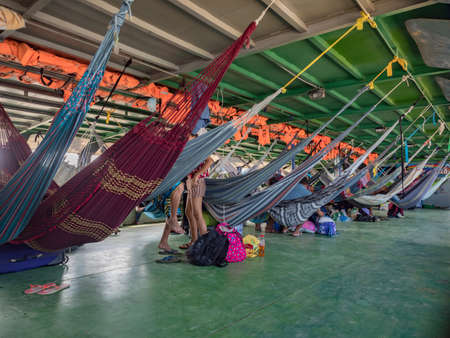Amazon River, Peru - Sep 19, 2019: Many beautiful, colorful hammocks on the cargo boat. Amazonia, trail from Santa Rosa to Iquitos. Amazon River, Peru. South Americaのeditorial素材