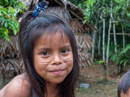 Iquitos, Peru - Dec 2019: Portrait of girl - an inhabitant of the Peru. Bora tribe, Nativa Bora...