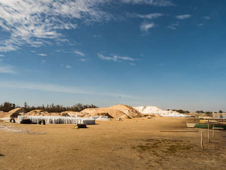 Lac Rose, Senegal, Africa (Pink Lake) - Feb 2019: Sacks of salt extracted from Retba Lake with red water. This is a UNESCO World Heritage Site. It is located north of the Cap Vert peninsula in Senegalのeditorial素材