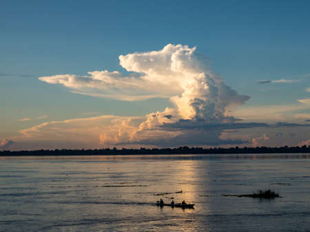 Magic sunset with beautiful clouds over the Amazon river. Amazon. Latin America.の写真素材
