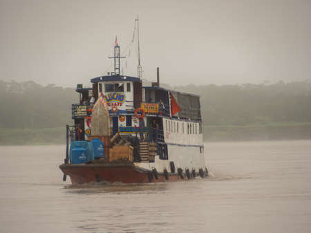 Caballococha, Peru - Sep, 2019: Panoramic view of ferry boats on the bank of the Amazon River during the low water seaoson. South America.のeditorial素材
