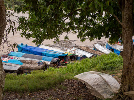 Atalaia do Norte, Brazil - Sep 2019: Many boats on the bank of Javari River (basin of Amazon River) with indians from various tribes from the Javari Valley- Amazon rainforest. Amazon. Latin Americaのeditorial素材