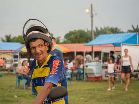 Tabatinga, Brazil - September 2017: Portrait of a man on a motorcycle in a helmet - Brazilian people. Latin Americaのeditorial素材