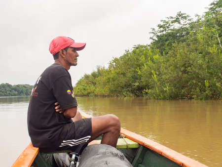 Jungle, Brazil - Dec 7, 2017: Portrait of a man with a red skin in the Amazon jungle. Amazon. Latin...