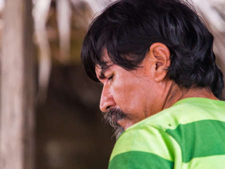 Jungle, Peru - Dec, 2017: Portrait of a man in the rain forest of Amazon jungle. Amazon. Amzonas. South America.のeditorial素材