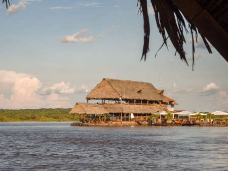Iquitos, Peru - Dec, 2017: Exclusive restaurant on the center of Amazon River. Al Frio y Al Fuego restaurant. Amazon. South America.のeditorial素材
