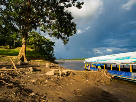 Iquitos, Peru - May, 2016: Boat on the bank of the Amazon River in the Amazon rain forest in Peru. Amzazonia. South America.のeditorial素材