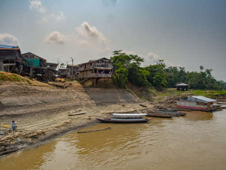 Amazon rainforest, Peru - Sep, 2017: Village on the high bank of the river during the low water...