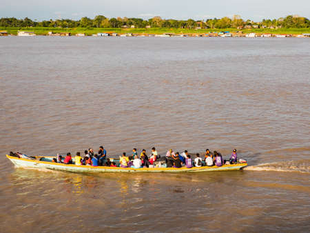 Santa Rosa, Peru, view for Leticia - Sep, 2019: Plenty of local people on the long wooden indian...
