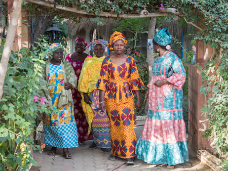 Senegal, Africa - Jan, 2019: Senegalese women in a traditional costume called 'boubou' and a swing on her headのeditorial素材