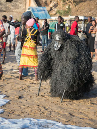 Dakar, Senegal - Feb, 2019: The Kumpo dance on the beach in Dakar. The Kumpo, Samay, and the Niasse are three traditional figures in the mythology of the Diola or Jola people in the Casamance. Africaのeditorial素材