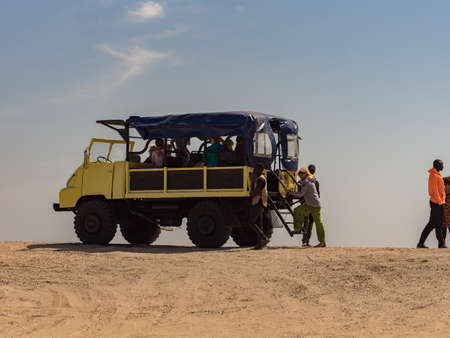 Dakar, Senegal - Feb, 2019: The last leg of the past Paris-Dakar tour along the shores of the Atlantic Ocean and the yellow 4WD car, Senegal, Africaのeditorial素材