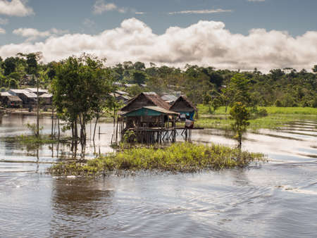 Pebas, Peru - May 13, 2016: Small village on the bank of the Amazon River. Amazon. South America. 'Tierra de Amor' - Land of loveのeditorial素材