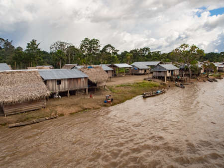 Amazon River, Peru - May, 2016: Small village on the bank of the Amazon River. Amazon. South America.のeditorial素材