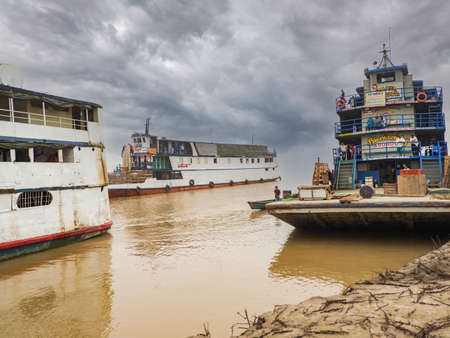 Caballococha, Peru - Sep, 2019: Ferry boats on the bank of the Amazon River during the low water seaoson. Amazonia, South America.のeditorial素材