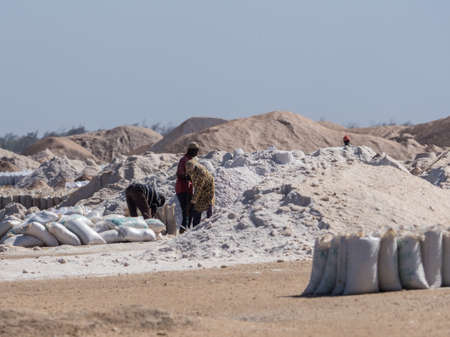 Lac Rose, Senegal, Africa (Pink Lake) - Feb 2019: Sacks of salt extracted from Retba Lake with red water. This is a UNESCO World Heritage Site. It is located north of the Cap Vert peninsula in Senegalのeditorial素材