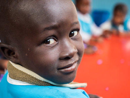 Senegal, Africa - January, 2019: Portrait of a small black boy in the school uniform. Senegal Africa.のeditorial素材