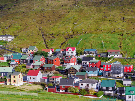 View of colorful wooden houses in the Funnings kommuna on Eysturoy Island, Denmark, Northern Europeの写真素材