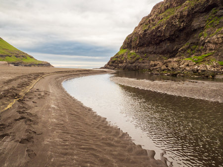 View from the trekking trail in Saksun on the island of Streymoy. The trail runs along the bay "Pollurin" to the Black Beach in Saksun - "Ãt Ã¡ LÃ³nna". The best hiking trails in the Faroe Islands.の写真素材