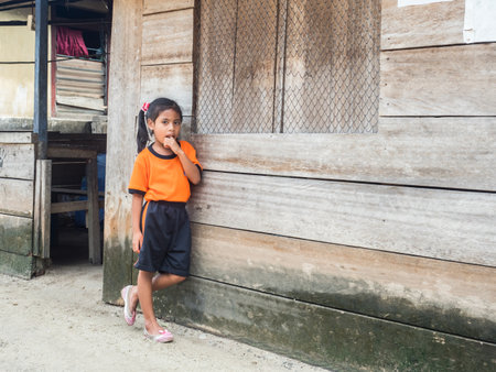 Pasar Kecamatan Pasanea, Indonesia - Feb, 2018: Portrait of a little girl in a small village on the Seram Island, Indonesia, Asiaのeditorial素材