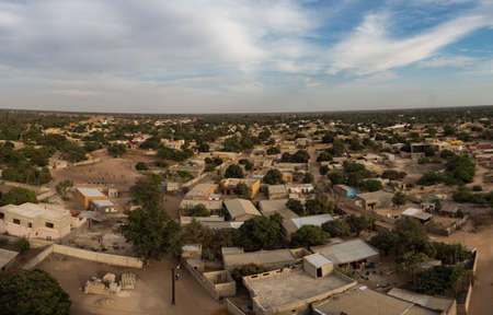 Nianing, Senegal, Africa - January 2019: View of a small African town with many brick houses from the top of church tower. West Africaのeditorial素材