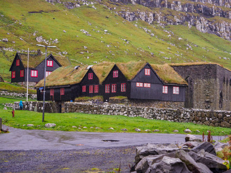 KirkjubÃ¸ur, Faroe Islands - October 2020: Typical wooden turf houses with red window on Streymoy Island., Denmark, Northern Europeのeditorial素材